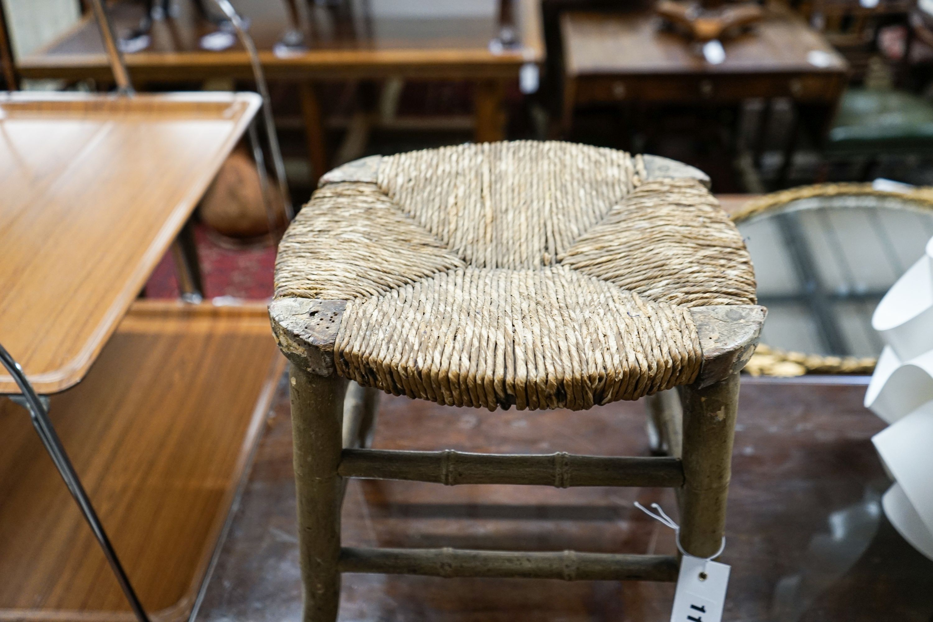 A Regency provincial rush seat simulated bamboo stool, width 34cm, depth 28cm, height 35cm
